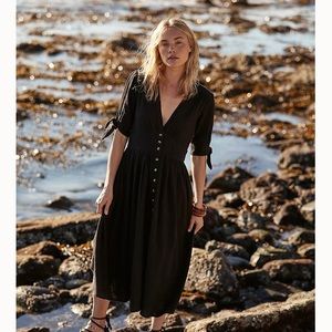 Black free people midi dress. Size large. Cute ties at sleeves. Deep v neck.